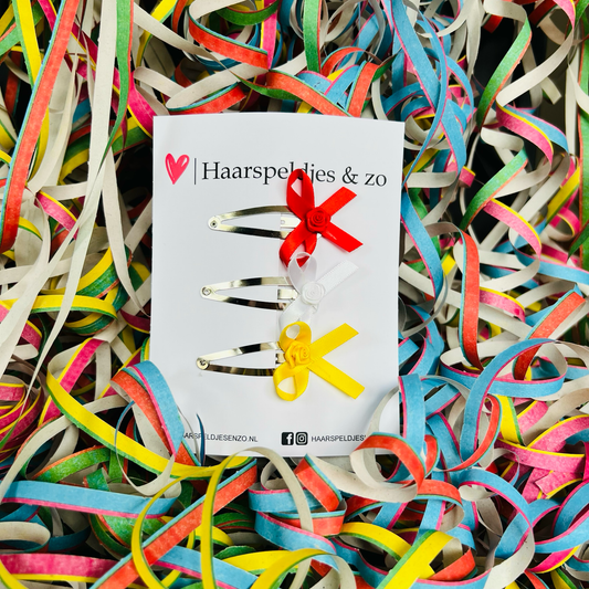 Oeteldonkse strikjes op klikklakspeld - carnaval