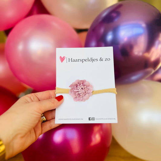Baby haarbandje - elastiek - met bloem - huidkleurig bandje - lichtpaarse bloem