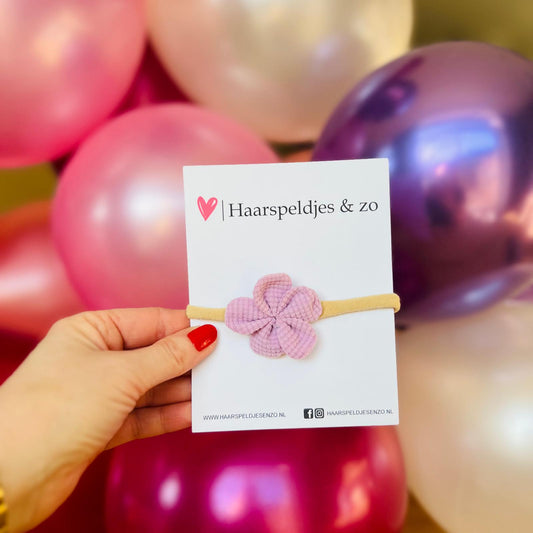 Baby haarbandje - elastiek - met bloem - huidskleur bandje - paarse bloem